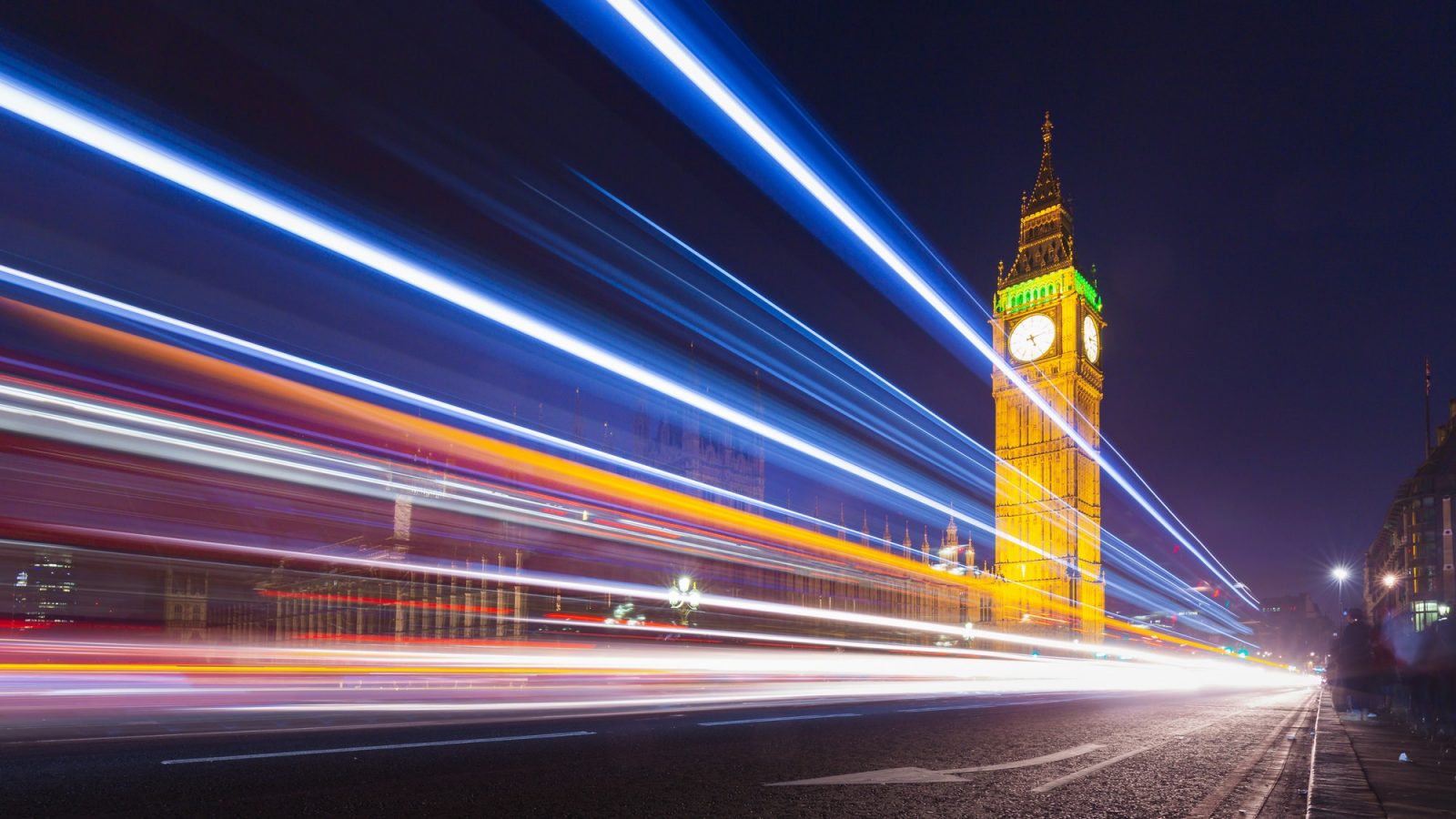 London Big Ben and Parliament with Bus Light Trails at Night, UK.